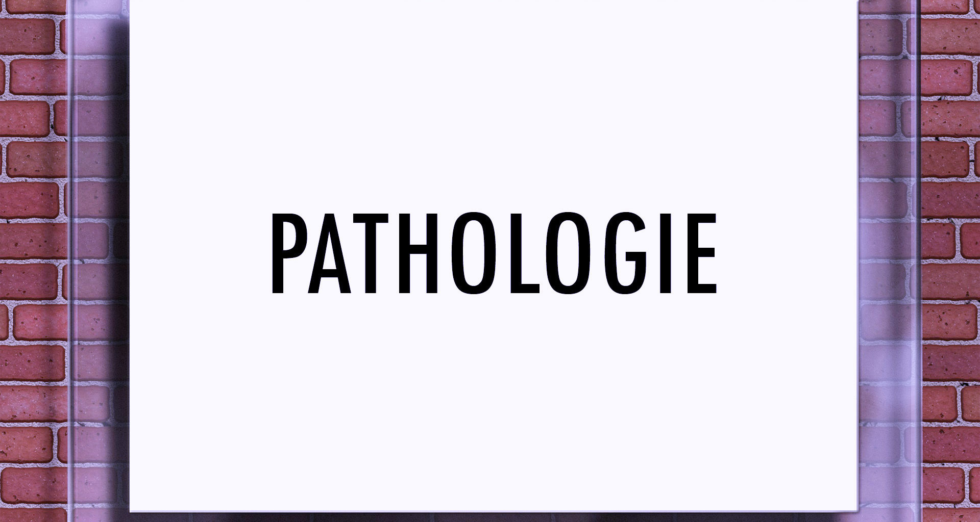 Schild mit der Aufschrift "Pathologie" auf Backsteinwand